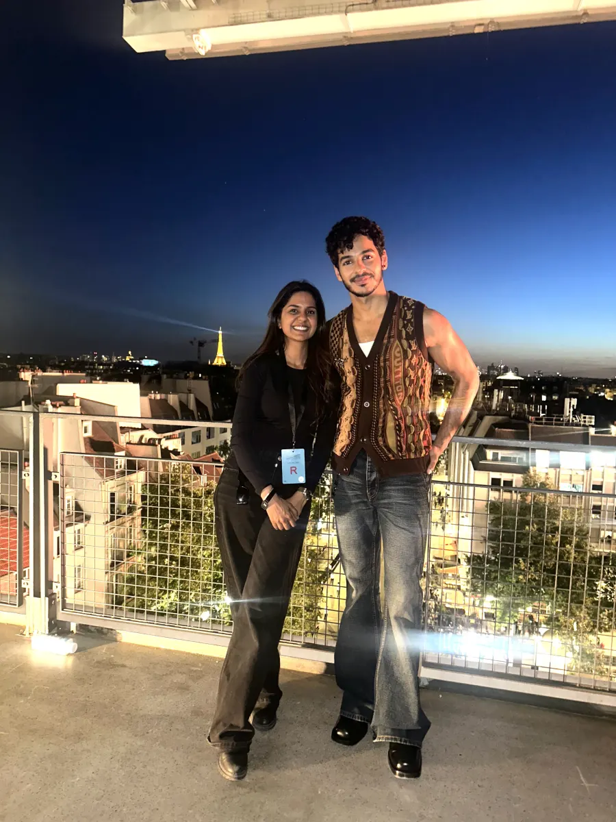 Shailza Swami with a guest on a rooftop overlooking Paris and the Eiffel Tower
